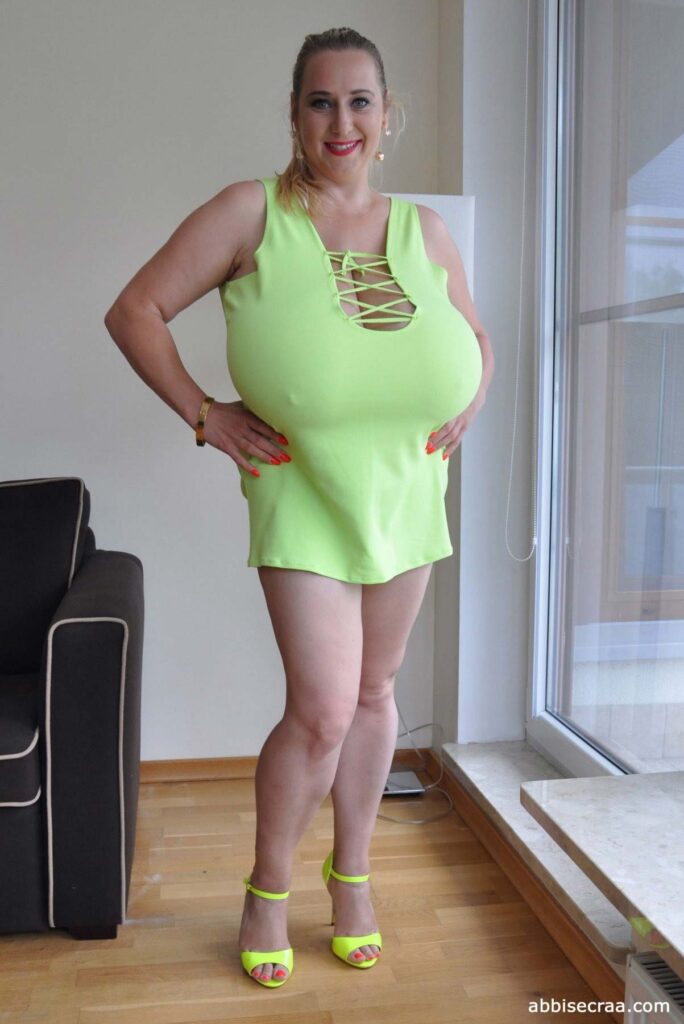 Abbi Secraa in a green dress